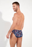 Man wearing a patterned brief on a white background