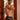 Man wearing black patterned boxer briefs standing in a doorway.