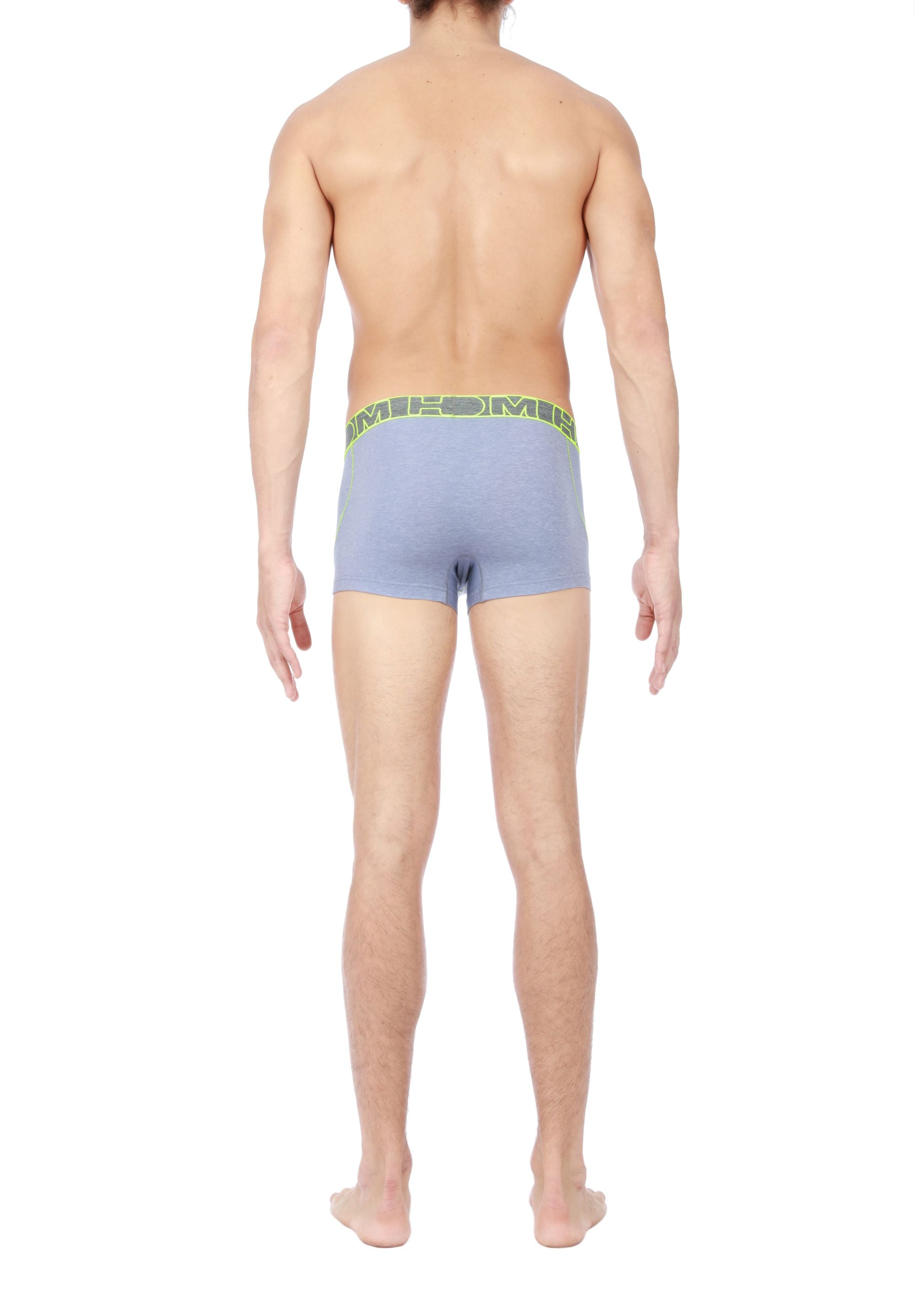 Person wearing grey boxer briefs with a green waistband on a white background