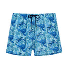 Blue swim shorts with turtle pattern on a white background