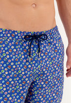A pair of navy blue beach boxer shorts with a colorful marble print and a drawstring waist.