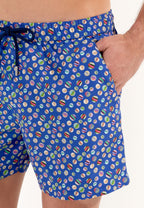 A pair of navy blue beach boxer shorts with a colorful marble print and a drawstring waist.