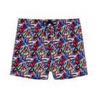 Colorful geometric patterned shorts on a white background