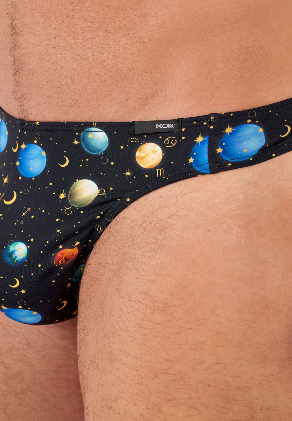 Solar system-themed underwear on a person's waistband