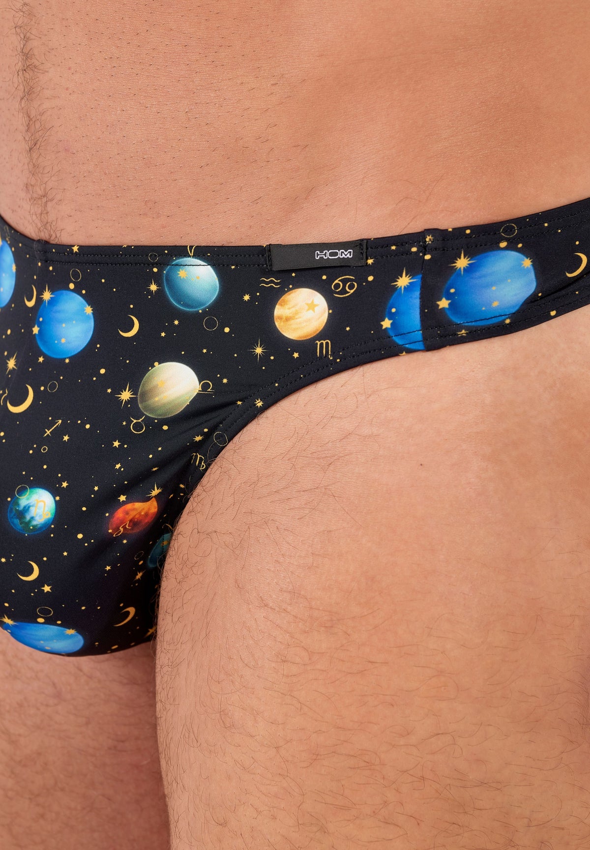 Solar system-themed underwear on a person's waistband