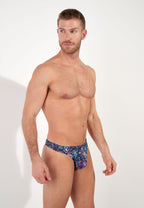 Man wearing a patterned underwear on a white background