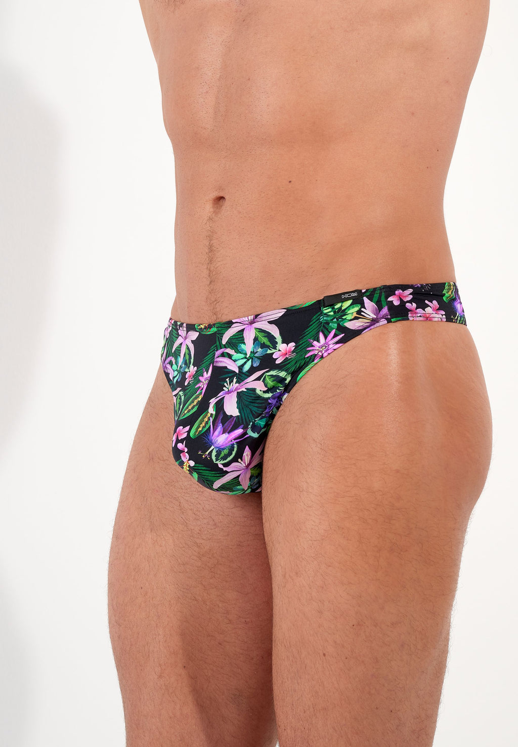 male model wearing floral-patterned men's underwear on a plain background