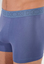 Blue boxer briefs with a visible brand logo on the waistband.
