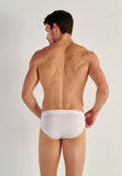 Man wearing a white underwear on a plain background