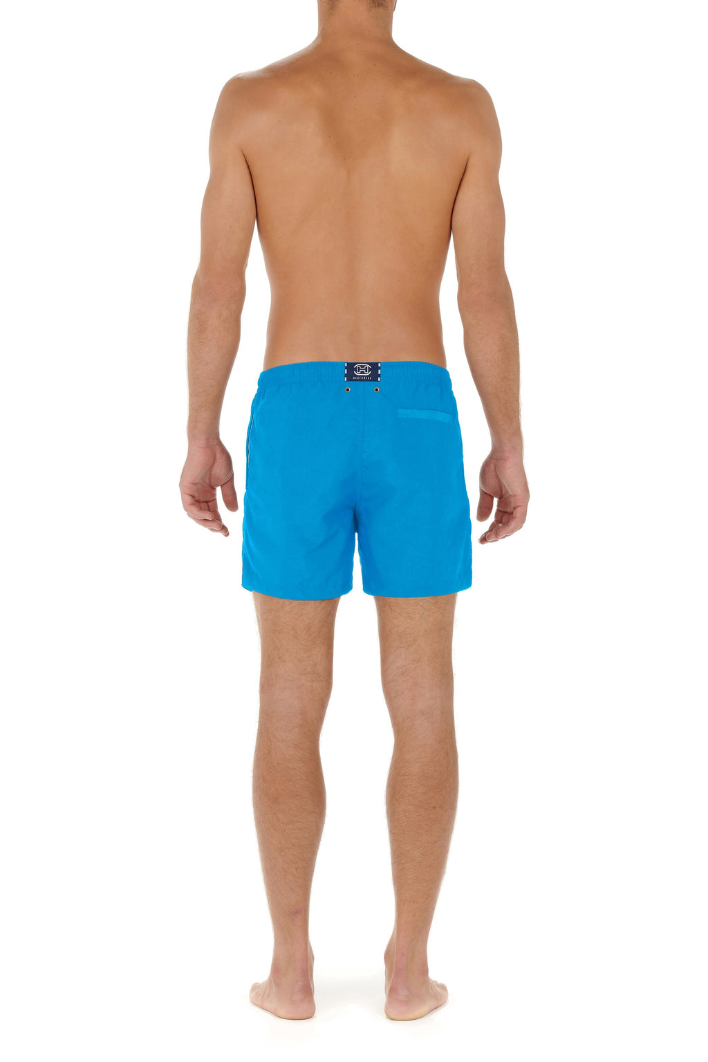Person wearing blue swim shorts on a white background