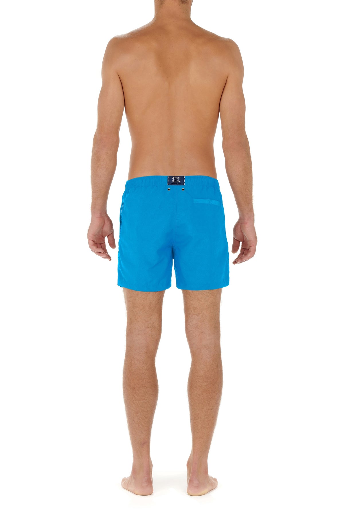 Person wearing blue swim shorts on a white background