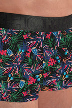 Floral-patterned boxer briefs with a black waistband on a person wearing them.