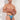 Man wearing colorful thong against a white background