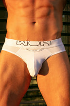 White men's underwear with brand logo on a blurred background